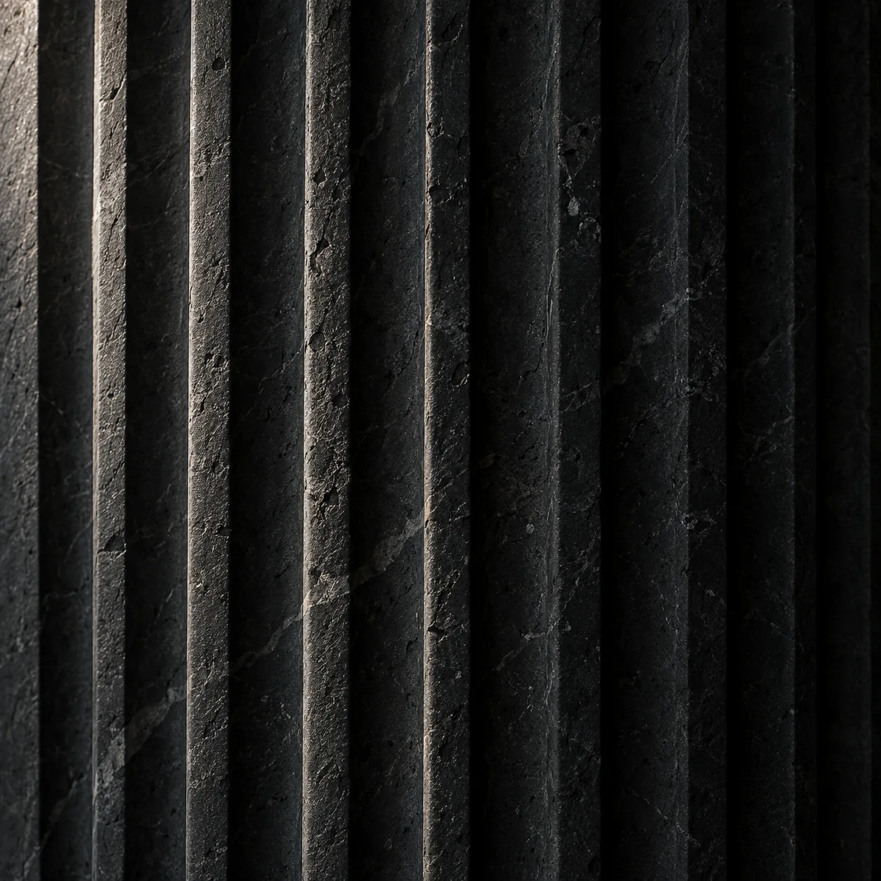 Close view of ribbed charcoal architectural stone